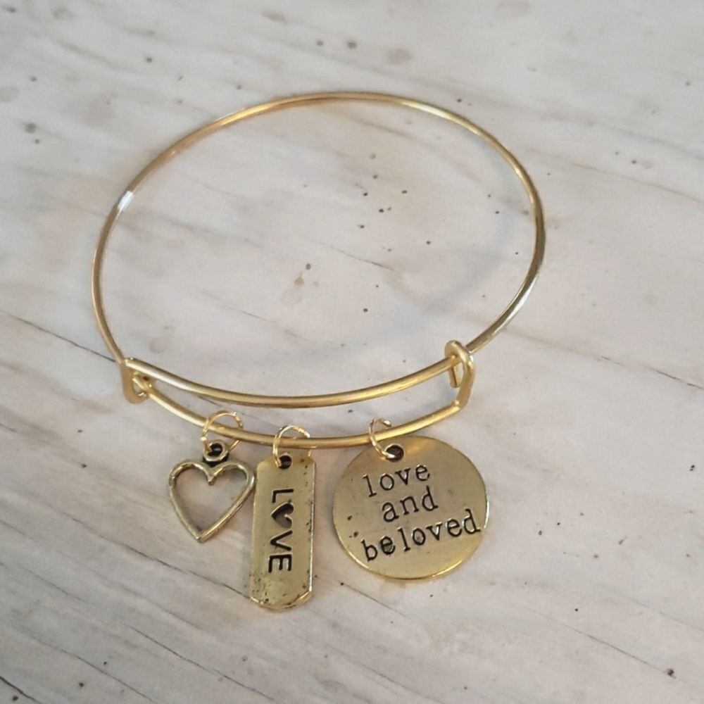 Bracelets by Sandra gold tone adjustable, love